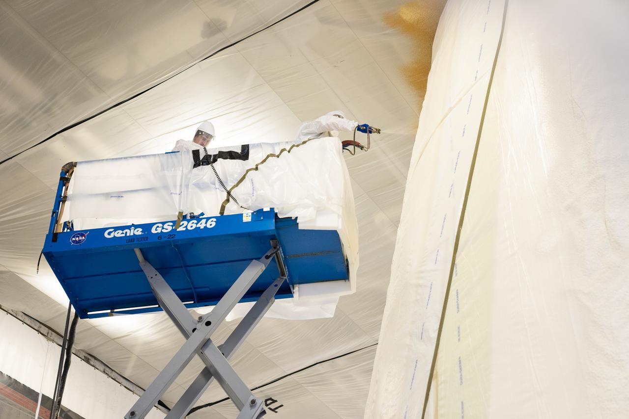 These photos show how technicians at NASA’s Marshall Space Flight Center in Huntsville, Alabama, have applied the thermal protection system material to the launch vehicle stage adapter (LVSA) of NASA’s SLS (Space Launch System) rocket for Artemis III, which will land astronauts on the Moon to advance long-term lunar exploration and scientific discovery and inspire the Artemis Generation. The LVSA is a cone-shaped element that connects the mega rocket’s core stage to its interim cryogenic propulsion stage (ICPS), partially enclosing it and protecting its avionics and electrical systems from the extreme pressures, sounds, and temperatures during launch and flight. Teams at Marshall began applying the thermal protection system material in the spring of 2023. Unlike other parts of the SLS rocket, the thermal protection system material for the LVSA is applied entirely by hand using a spray gun. During application, the technicians use a thin measuring rod to gauge the proper thickness. Once the thermal protection system has cured, certain areas are sanded down to meet parameters. The entire process takes several months.  The LVSA is fully manufactured at Marshall by NASA, lead contractor Teledyne Brown Engineering, and the Jacobs Space Group’s ESSCA contract. The LVSA for Artemis III is the last of its kind as future SLS rockets will transition to its next, more powerful Block 1B configuration beginning with Artemis IV. NASA is working to land the first woman and first person of color on the Moon under Artemis. SLS is part of NASA’s backbone for deep space exploration, along with the Orion spacecraft, advanced spacesuits and rovers, the Gateway in orbit around the Moon, and commercial human landing systems. SLS is the only rocket that can send Orion, astronauts, and supplies to the Moon in a single mission.